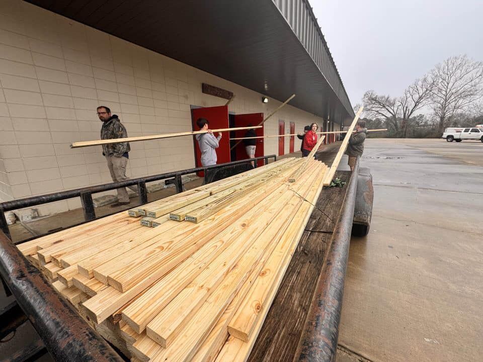 Stacked lumber on a trailer ready for a build project