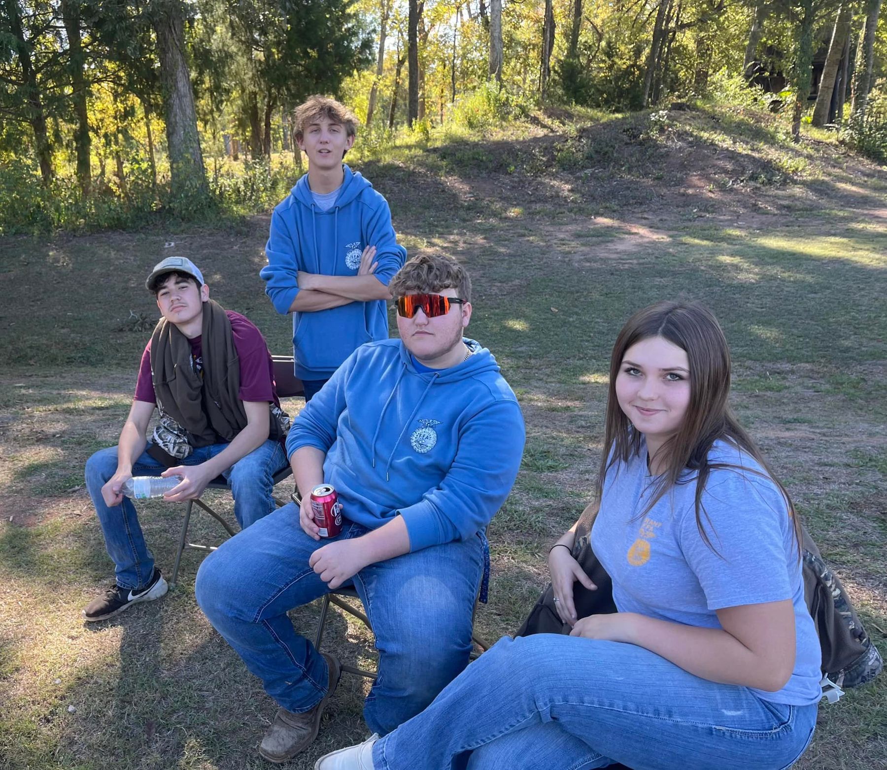 Group of high school students smiling together outdoors during a chapter event